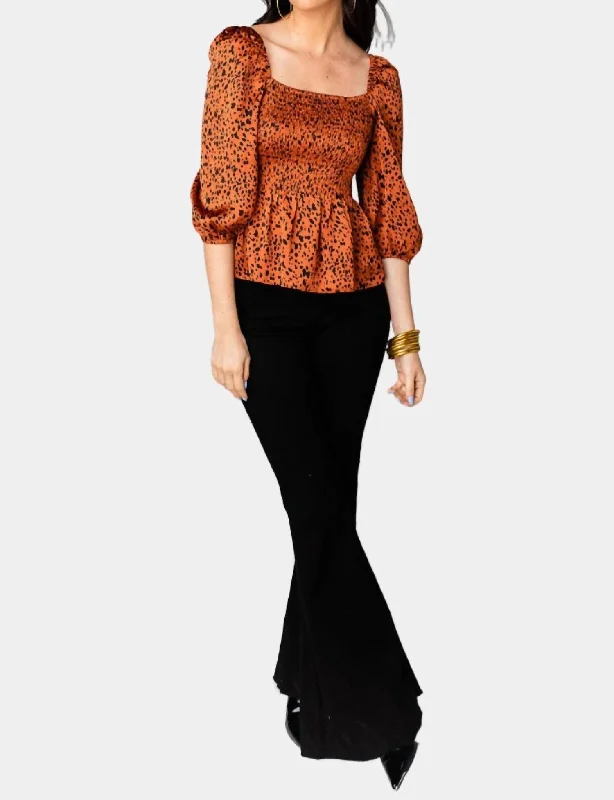 Gwendolyn Peplum Top In Cognac